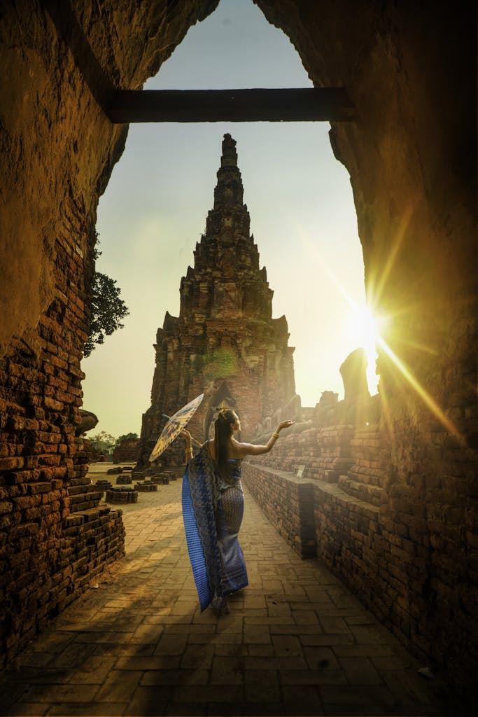 Woman Wearing Blue Dress With Umbrella during Sunset
